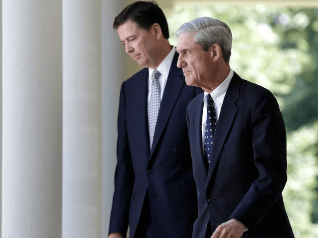 WASHINGTON, DC - JUNE 21: James Comey (L) FBI Director nominee walks with outgoing FBI Director Robert Mueller (R) to a ceremony annoucing Comey's nomination in the Rose Garden at the White House June 21, 2013 in Washington, DC. Comey, a former Justice Department official under President George W. Bush, …