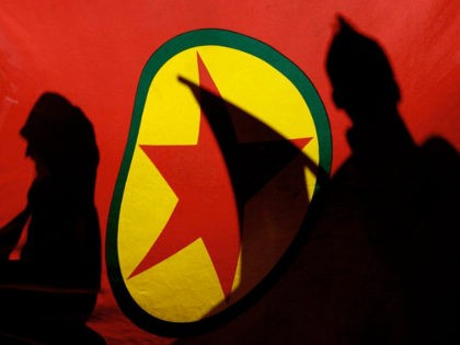** FILE ** In this Nov. 12, 2007 file picture, Kurdish demonstrators are silhouetted by a Kurdistan Workers' Party (PKK) flag during a protest in the Cypriot capital of Nicosia. Kurdish rebels have kidnapped three German climbers on Mount Ararat, the governor of a province in eastern Turkey said Wednesday …