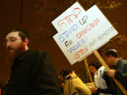 Some 2,000 people attend a rally to support religious tolerance after a series of recent anti-semitic attacks struck synagogues and homes March 24, 2004 at the Lipa Green Centre in Toronto, Canada. (Photo by Donald Weber/Getty Images)