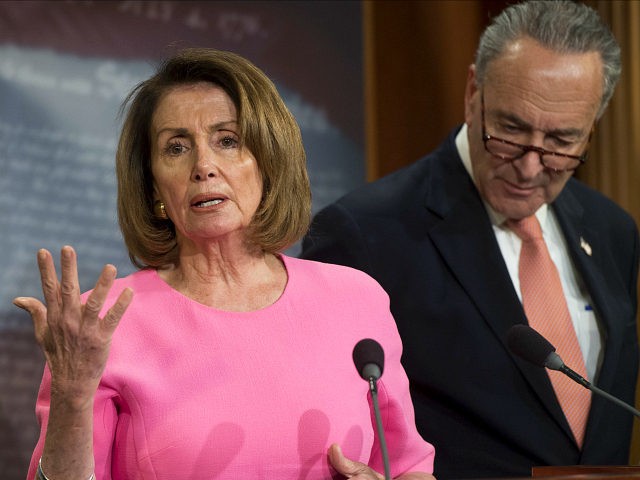 US Senate Minority Leader Chuck Schumer, Democrat of New York, and House Democratic Leader Nancy Pelosi, Democrat of California, speak about US President Donald Trump's Fiscal Year 2018 budget at the US Capitol in Washington, DC, May 23, 2017. / AFP PHOTO / SAUL LOEB (Photo credit should read SAUL …