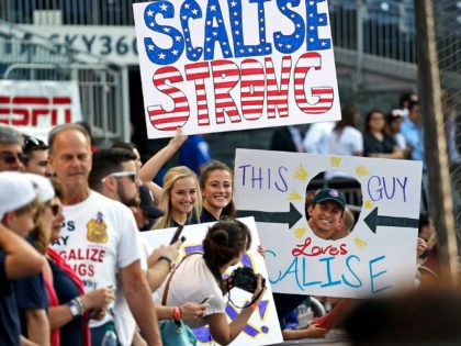 Supporters of House Majority Whip Steve Scalise, R-La., hold signs before the Congressional baseball game, Thursday, June 15, 2017, in Washington. The annual GOP-Democrats baseball game raises money for charity. (AP Photo/Alex Brandon)