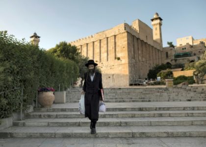A Jewish man walks outside the Patriarchs' Tomb, known in Arabic as the Ibrahimi Mosque, in the the divided West Bank city of Hebron on May 29, 2017