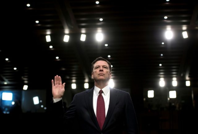 Ousted FBI director James Comey is sworn in during a hearing before the Senate Select Comm