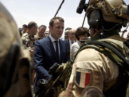 France is attempting to overcome US reservations about financial backing for anti-terrorism forces in the Sahel region of Africa, pictured in May 2017 when French President Emmanuel Macron (C), visited the French troops in northern Mali