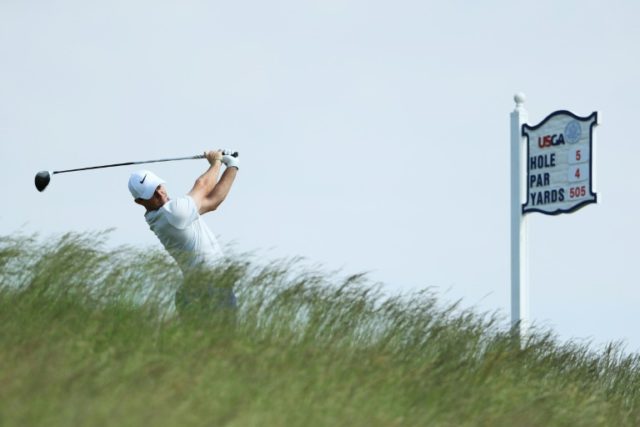 Rory McIlroy of Northern Ireland plays his shot beside the infmaous Erin Hill fescue prior