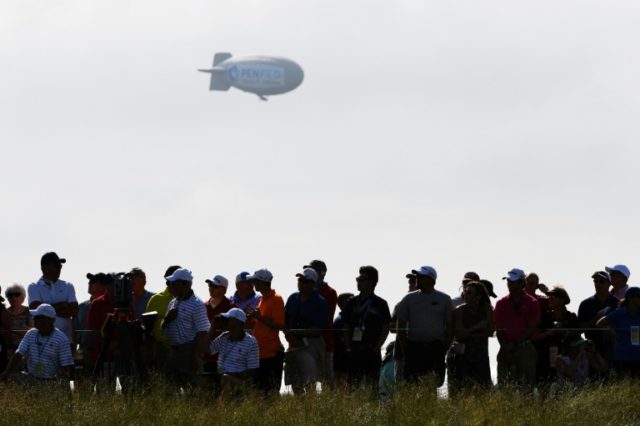 A blimp floats over the crowd during the first round of the 2017 U.S. Open at Erin Hills o