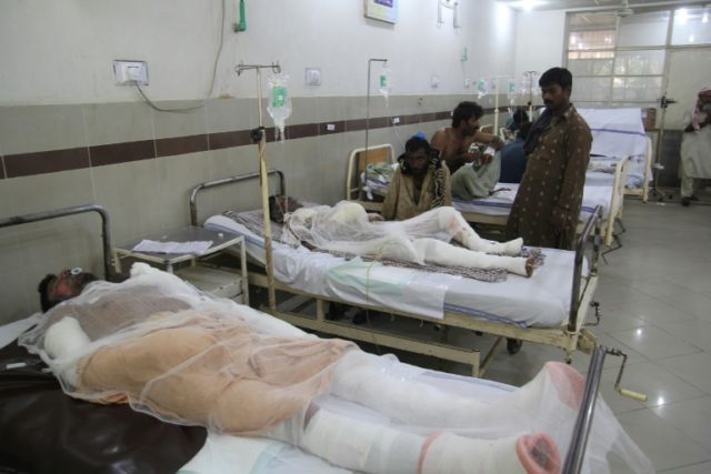 Pakistani burn victims are treated at a hospital in Bahawalpur after oil tanker after caug