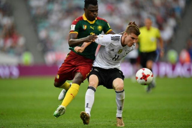 Germany's forward Timo Werner (R) challenges Cameroon's defender Ernest Mabouka during the