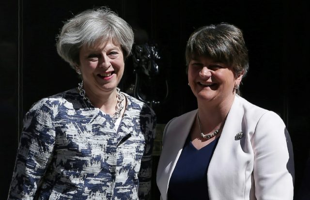 Britain's Prime Minister Theresa May (left) poses for a picture with Democratic Unionist P