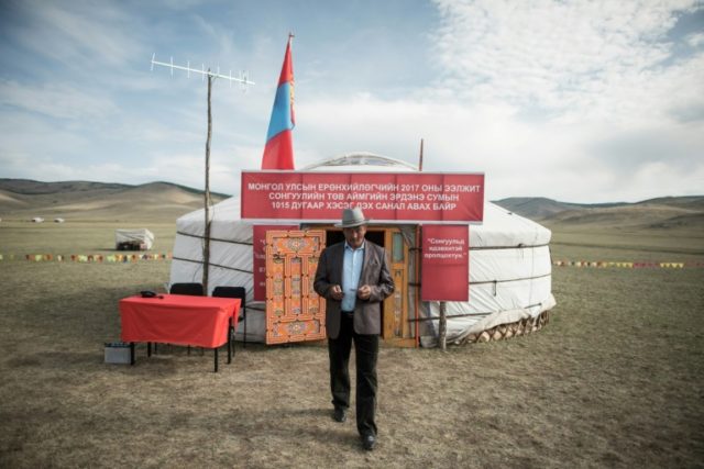 A man leaves after voting in the Mongolian presidential election at the Erdene Sum Ger (Yu