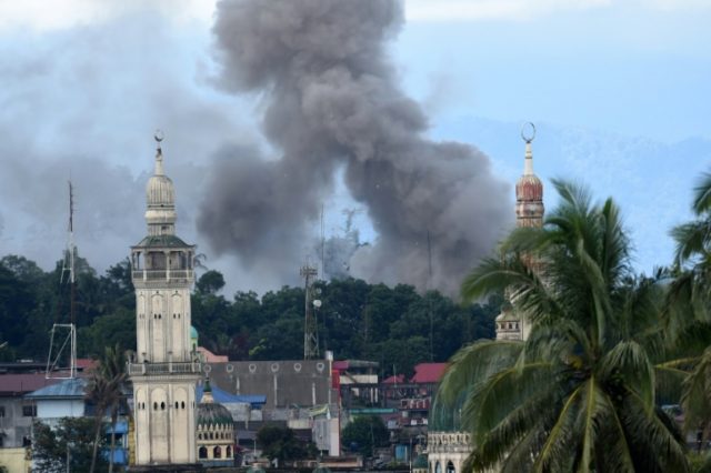 Smoke billows after bombing by Philippine air force planes of Islamist militants in Maraw