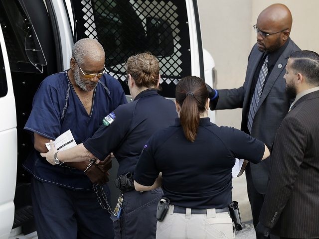 James Mathew Bradley Jr., 60, of Clearwater, Florida, left, arrives at the federal courtho