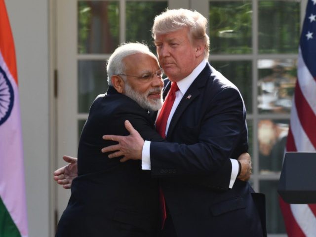 Donald Trump Narendra Modi hug (Nicholas Kamm / AFP / Getty)
