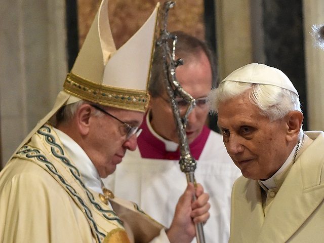 Pope Emeritus Benedict XVI (R) stands by Pope Francis in St Peter's basilica before the opening of the "Holy Door" to mark the start of the Jubilee Year of Mercy, on December 8, 2015 in Vatican. Pope Francis marks the start of an extraordinary Jubilee year for the world's 1.2 …