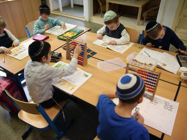 BERLIN, GERMANY - NOVEMBER 08: Jewish children attend a first grade math class at the Or Avner traditional Jewish school during a visit by Ashkenazi Chief Rabbi of Israel David Lau on November 8, 2013 in Berlin, Germany. A recent study released by the European Union Fundamental Rights Agency concludes …