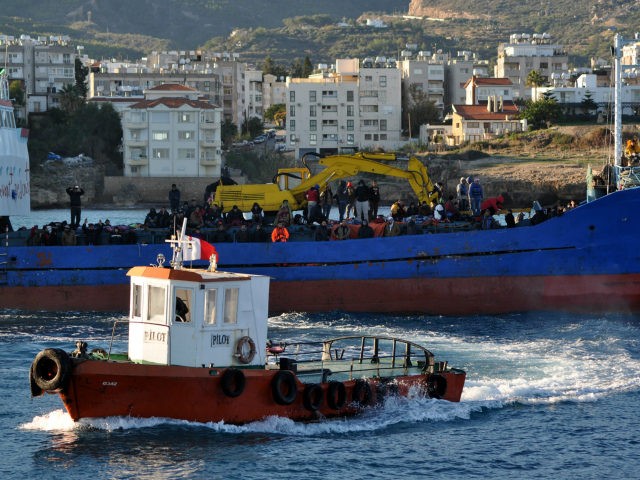 A Turkish Cypriot authority rescue vessel sails towards a fishing boat crammed with some 220 Syrian migrants near the port of Kyrenia off the northern coast of the Turkish Republic of Northern Cyprus, which is recognised only by Turkey, after the vessel hit rough seas in the Mediterranean on November …