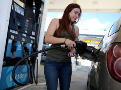 PEMBROKE PINES, FL - APRIL 21: Gabrielle Smith pumps gas at the Victory gas station on April 21, 2014 in Pembroke Pines, Florida. According to the Lundberg Survey the average price for a gallon of regular gas is now $3.69- the highest price since March of last year. (Photo by …