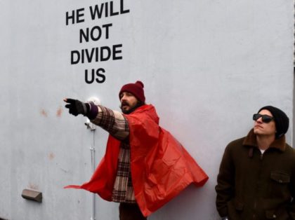 US actor Shia LaBeouf(L) during his He Will Not Divide Us livestream outside the Museum of the Moving Image in Astoria, in the Queens borough of New York January 24, 2017 as a protest against President Donald Trump. (TIMOTHY A. CLARY/AFP/Getty Images)