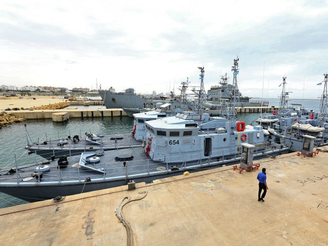 A general view shows four Libyan Coast Guard ships docked in the harbour of the capital Tr