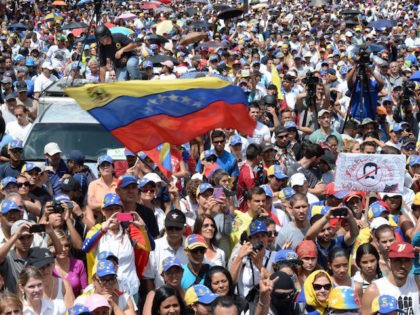 Thousands of opposition activists take part in a demonstration marking 100 days of protests against Venezuelan President Nicolas Maduro in Caracas, on July 9, 2017. Venezuela hit its 100th day of anti-government protests on Sunday, one day after its most prominent political prisoner, Leopoldo Lopez, vowed to continue his fight …