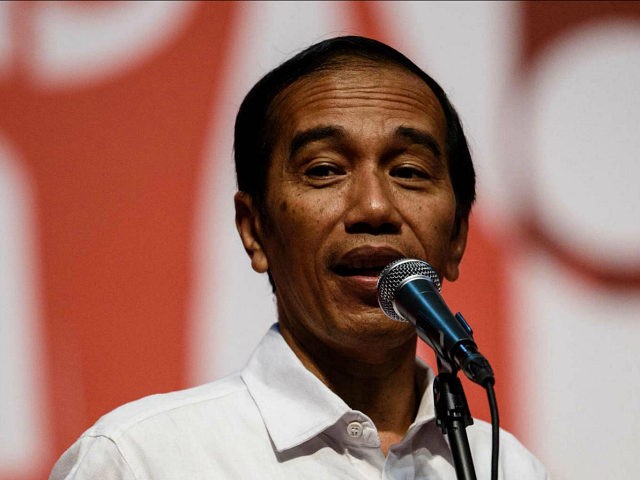 Indonesian President Joko Widodo speaks at an event to meet workers from Indonesia during