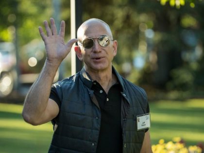 Jeff Bezos, chief executive officer of Amazon, arrives for the third day of the annual All