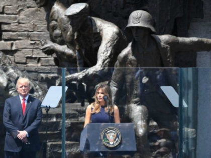 US President Donald Trump (L) looks on as his wife Melania Trump gives a speech in front of the Warsaw Uprising Monument on Krasinski Square during the Three Seas Initiative Summit in Warsaw, Poland, July 6, 2017. / AFP PHOTO / JANEK SKARZYNSKI (Photo credit should read JANEK SKARZYNSKI/AFP/Getty Images)