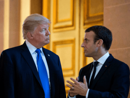 French President Emmanuel Macron talks to US President Donald Trump, as they visit Napoleon Bonaparte's tomb at Les Invalides in Paris, on July 13, 2017, during Trump's 24-hour trip that coincides with France's national day and the 100th anniversary of US involvement in World War I.
