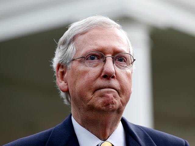 Senate Majority Leader Mitch McConnell of Ky., listens to a question while speaking with t