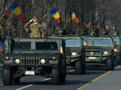 Romanian army forces take part in a military parade to celebrate the National Day of Roman