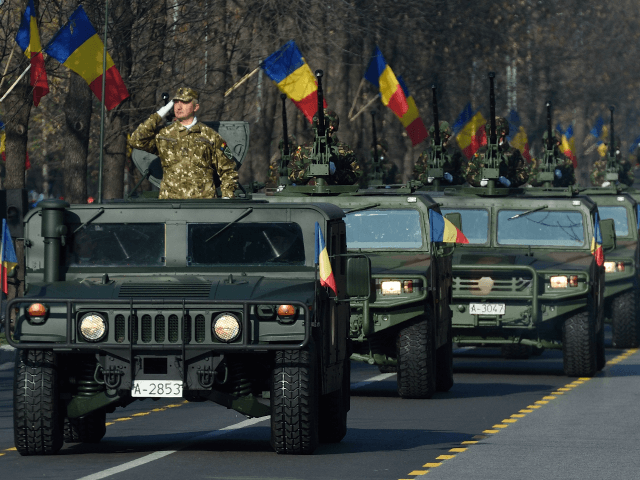 Romanian army forces take part in a military parade to celebrate the National Day of Roman