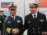 KALININGRAD, RUSSIA - JULY 21: Russian Vice-Admiral Alexander Fedotenkov (R) welcomes Chinese Vice-Admiral Tian Zhong as China's missile destroyer Hefei arrives at Baltic city ahead of the 'Joint Sea 2017' on July 21, 2017 in Kaliningrad, Russia. China and Russia hold a naval drill 'Joint Sear 2017' at Baltic Sea …