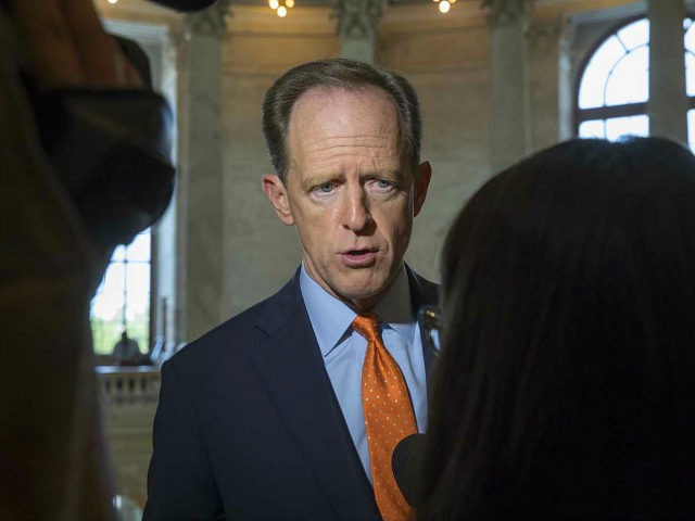Sen. Pat Toomey, R-Pa. responds to questions on Capitol Hill in Washington, Thursday, May