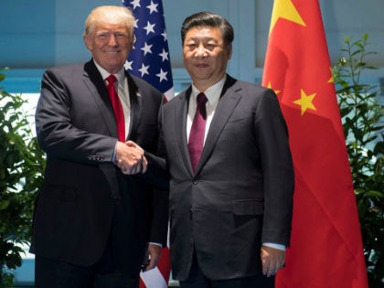 US President Donald Trump and Chinese President Xi Jinping (R) shake hands prior to a meeting on the sidelines of the G20 Summit in Hamburg, Germany, July 8, 2017. / AFP PHOTO / POOL / SAUL LOEB (Photo credit should read SAUL LOEB/AFP/Getty Images)