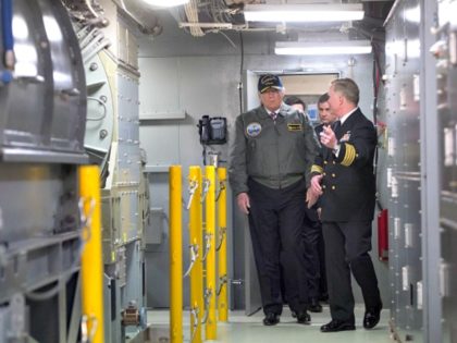 Trump inside aircraft carrier Saul LoebAFP