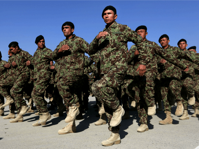 New members of the Afghan National Army march during their graduation ceremony at the Afghan Military Academy in Kabul, Afghanistan, Sunday, Jan, 24, 2016. (AP Photo/Rahmat Gul)