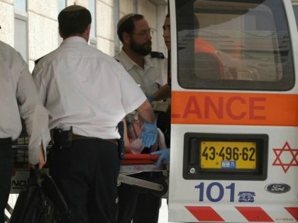 Israeli medics carry a wounded Ultra-nationalist rabbi out of an ambulance after he was stabbed at Jerusalem's Old City Damascus gate, on March 18, 2008 at Hadassah hospital. An ultra-nationalist Israeli rabbi was lightly wounded today after being stabbed near the Damascus gate into Jerusalem's walled Old City, police said. …