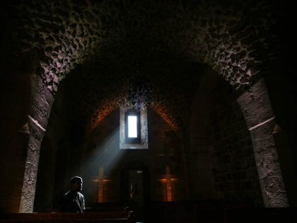 MARDIN, TURKEY - DECEMBER 22: A priest is seen inside of Assyrian Protestant Church located in Mardin province of Turkey on December 22, 2016. Mardin hosts people from different religions and cultures for centuries with historical structures and background. (Photo by Sebnem Coskun/Anadolu Agency/Getty Images)