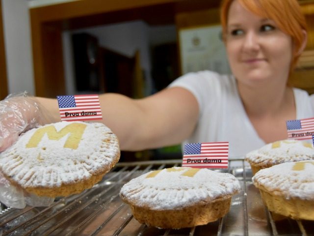 A worker in a bakery in Sevnica, Slovenia shows off a First Lady Melania Trump apple pie.