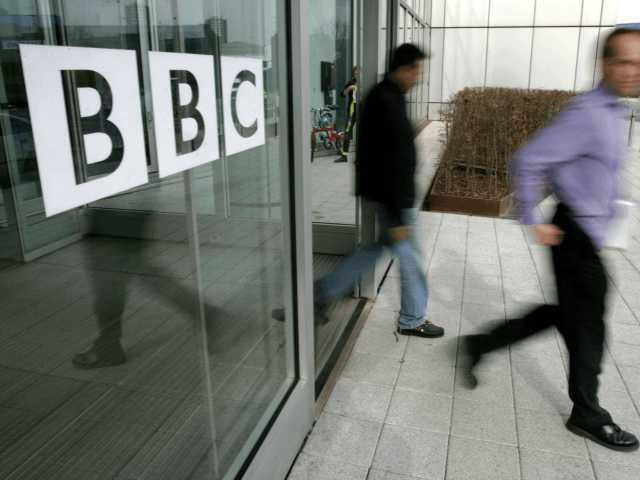 People leave the BBC building, in the corporation's West London headquarters, 21 March 2005.