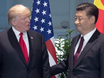 FILE - In this Saturday, July 8, 2017, file photo, U.S. President Donald Trump, left, and Chinese President Xi Jinping arrive for a meeting on the sidelines of the G-20 Summit in Hamburg, Germany. The United States apologized for mistakenly describing Xi as the leader of Taiwan, China said Monday, …