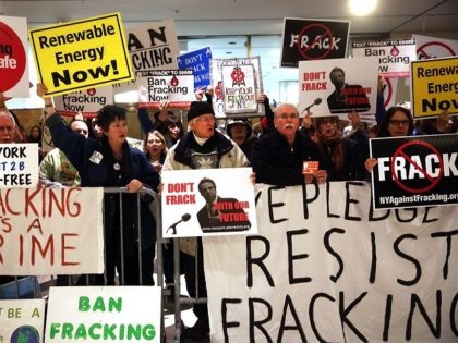 ALBANY, NY - JANUARY 08: Anti-fracking protesters gather outside of the auditorium before New York Gov. Andrew Cuomo gives his fourth State of the State address on January 8, 2014 in Albany, New York. Fracking for natural gas has become a contentious issue in New York State and the governor …