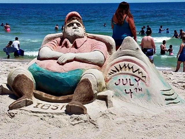 inspired-by-beachgate-artists-made-a-sand-sculpture-of-chris-christie-lounging-on-the-jers