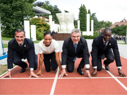 From left to right, Eric Garcetti, Mayor of Los Angeles, Allyson Felix, US Sprinter, International Olympic Committee, IOC, President Thomas Bach from Germany, and Michael Johnson, former US Sprinter, pose on the 200m track during a visit of the Los Angeles 2024 Candidate City delegation, at the Olympic Museum, in …