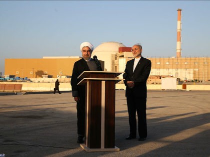 In this photo released by the Iranian Presidency Office, President Hassan Rouhani, left, speaks as he is accompanied by the head of Iran's Atomic Energy Organization Ali Akbar Salehi during his visit to the Bushehr nuclear power plant just outside the port city of Bushehr, southern Iran, Tuesday, Jan. 13, …