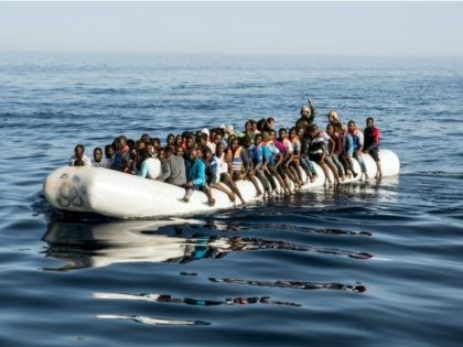 A picture taken on June 27, 2017 shows Libyan coast guardsmen standing in a dinghy carrying illegal immigrants during a rescue operation of 147 people who were attempting to reach Europe, off the coastal town of Zawiyah, 45 kilometres west of the capital Tripoli. More than 8,000 migrants have been …
