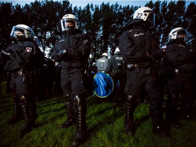 HAMBURG, GERMANY - JULY 02: Riot police surround anti-G20 protesters and the sleeping tent