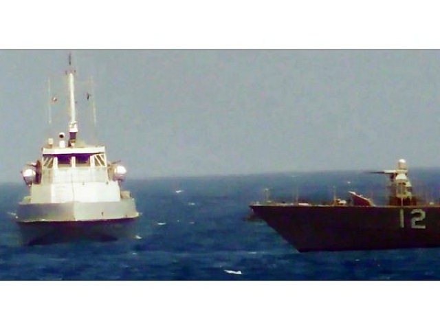 This video grab still image obtained July 25, 2017, courtesy of the US Navy, shows an IRGCN boat heading towards the USS Thunderbolt in the Gulf. A US Navy patrol ship fired warning shots at an Iranian Revolutionary Guard Corps vessel in the Persian Gulf July 25, 2017 after it …