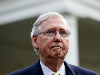 Senate Majority Leader Mitch McConnell of Ky., listens to a question while speaking with t