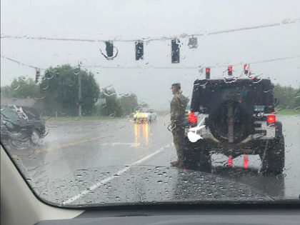 Kentucky Soldier Stands in Pouring Rain to Salute Funeral Procession